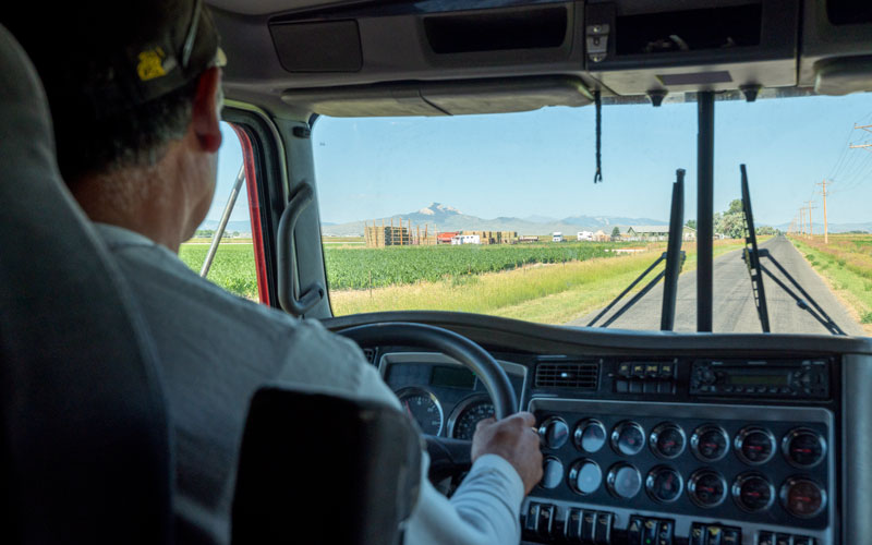 Male student driving a semi truck.