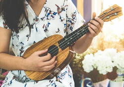 person playing ukulele