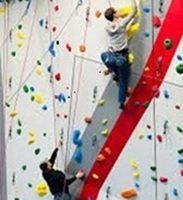 People using the climbing wall