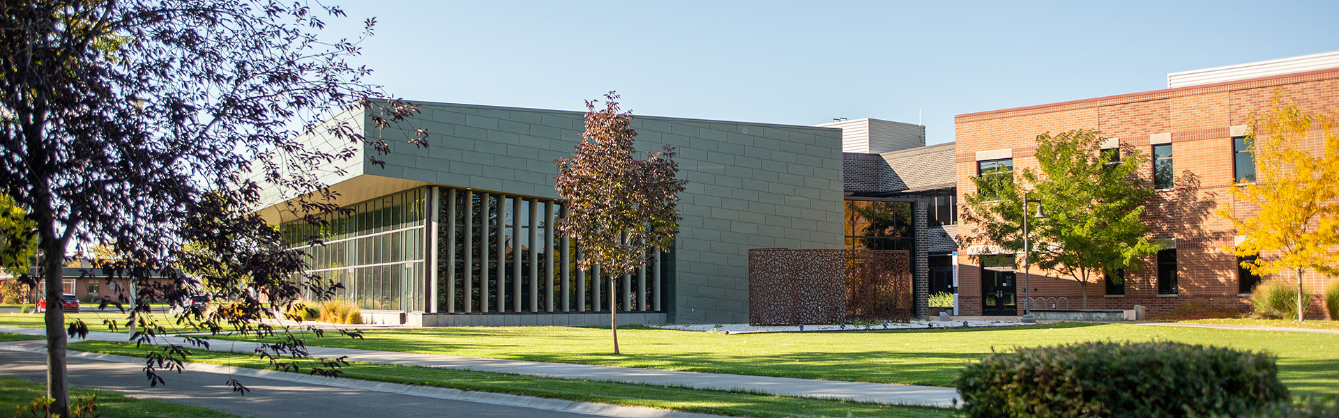 The Yellowstone Building with floor to ceiling windows in with fall colors